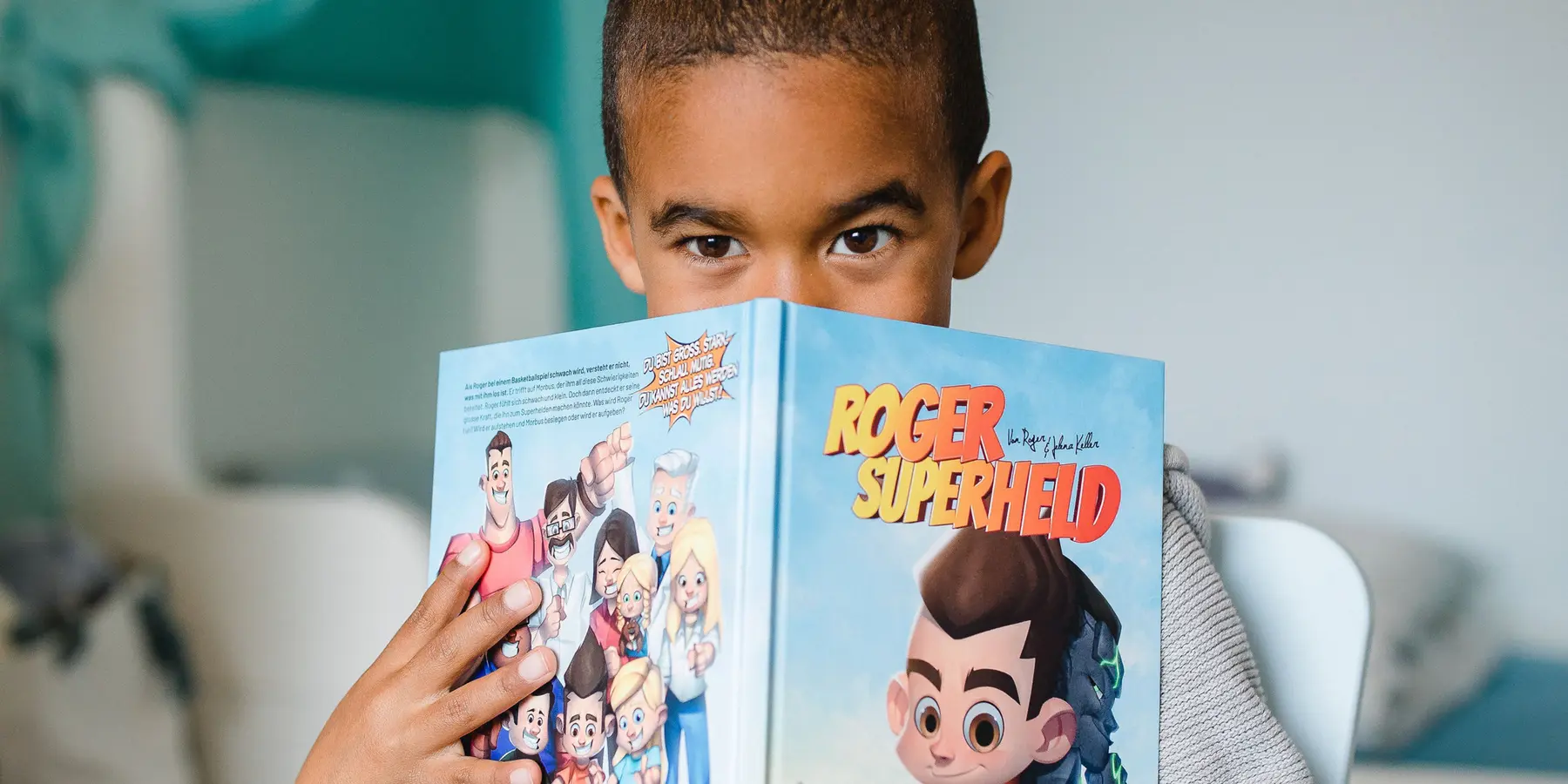 Child reading the Roger Superhero book